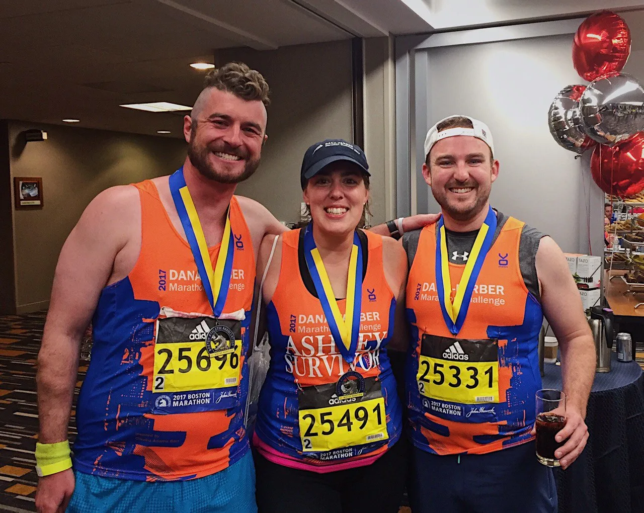 Modesty Shorts band members running the 2017 Boston Marathon with Dana-Farber bibs