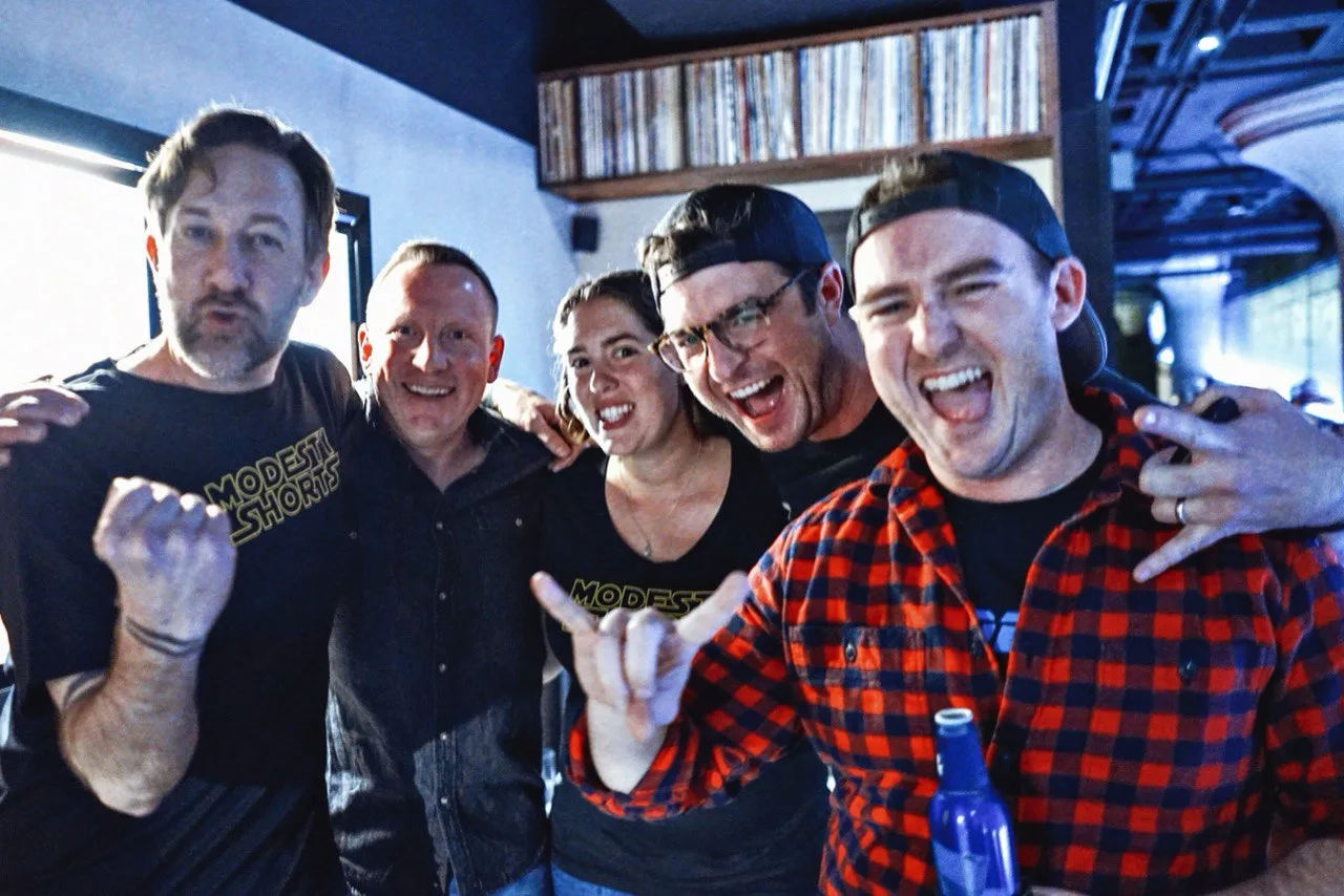 Modesty Shorts hanging out at a vinyl bar