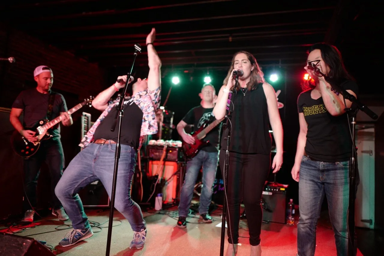 Full band performing on stage