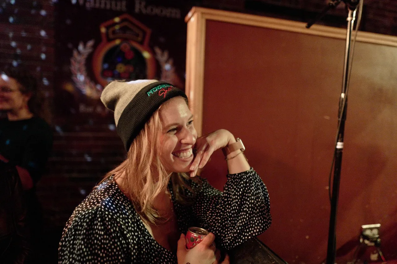 Fan rocking a Modesty Shorts beanie at The Walnut Room